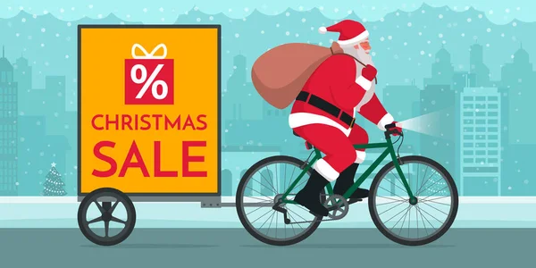 サンタクロースは 街の通り クリスマスセールのコンセプトでトレーラー広告で自転車に乗って — ストックベクタ