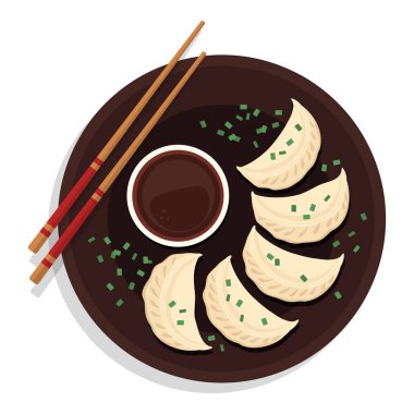 Çin mantısı ve soya sosu tabakta.