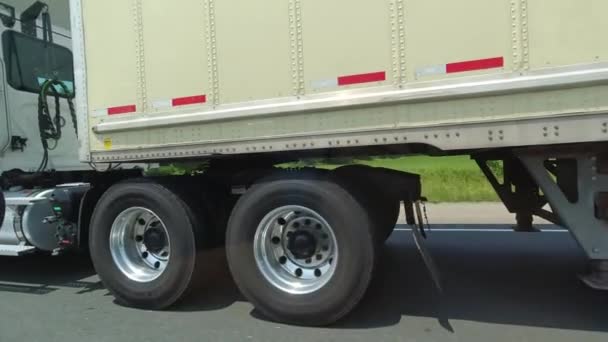Close Cargo Truck Wheels Tires Passing Semi Truck Highway Freight — Vídeos de Stock