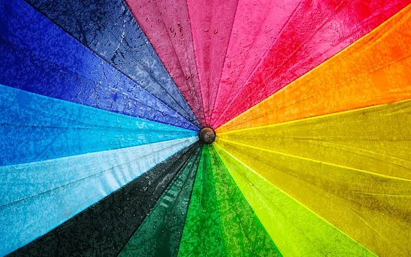 Foto Van Regenboog Gekleurde Paraplu Die Een Abstracte Achtergrond Vormt — Stockfoto