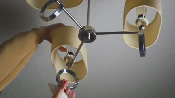 Burnt Out Light Bulb Feman Unscrews Lamp Chandelier Replacing Light — Stock Video