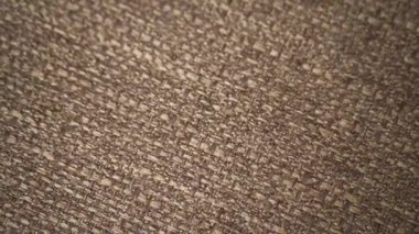 Parlak spandeks likra kumaşının detaylı kumaş dokusunu kapayın ve makro yakın plan çekimde doli ile akın edin. Dalgalı, temiz elastik dokuma malzemesi. Tekstil soyut arka planı. Kıyafet endüstrisi konsepti.