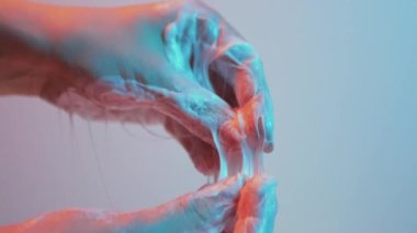 Womens hands form a beautiful web of shaving foam Slow motion Cinematic