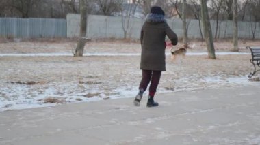 A girl jumps imitating a dog love for animals