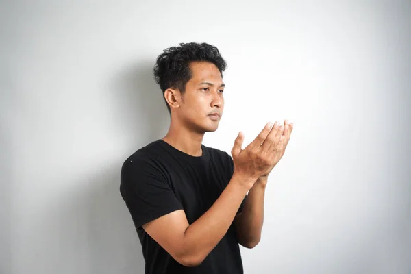 Young Handsome Man Praying Wearing Black Shirt Person Isolated White — Stock Photo, Image