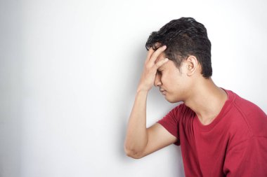 Sad man holding his forehead. Stress, sadness, worry