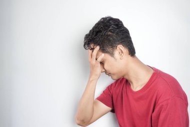 Sad man holding his forehead. Stress, sadness, worry