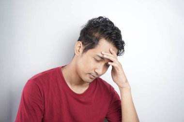 Sad man holding his forehead. Stress, sadness, worry