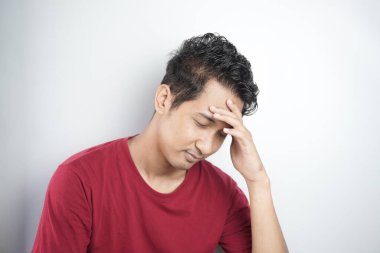 Sad man holding his forehead. Stress, sadness, worry