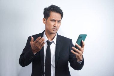 Mad male employee having smartphone problems or breakdown