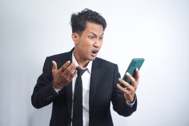 Mad male employee having smartphone problems or breakdown