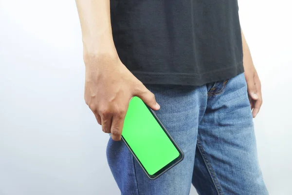 Man with Green Screen Chroma Key Smartphone in Office. Asian Person using Internet, Social Media, Online Shopping with Mobile Phone Device. Focus on Display, Hand
