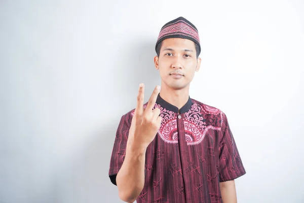 Smiling Cheerful Young Man Wearing Koko Shirt Showing Two Fingers — Stock Photo, Image