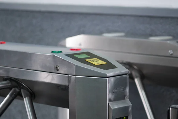 The tripod turnstile with electronic card reader is closed