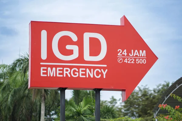 sign at the hospital points towards the emergency room entrance .IGD sign or emergency room. UGD hospital