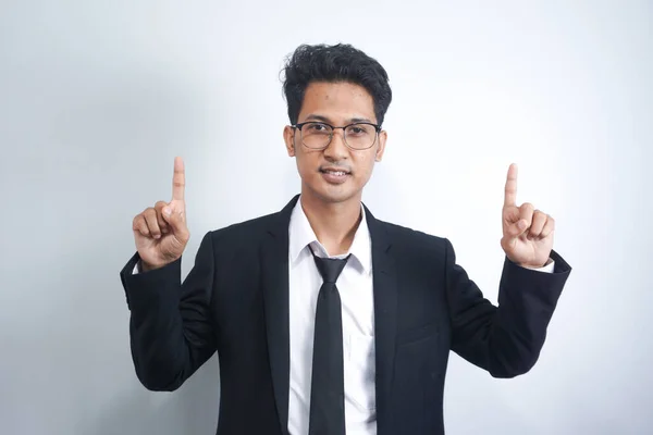 Attractive Young Asian Man Suit Pointing His Finger Isolated Gray — Stok fotoğraf