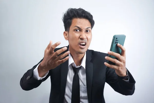 Handsome Young Asian Man Wearing Suit Angry Looking Cellphone — Stockfoto