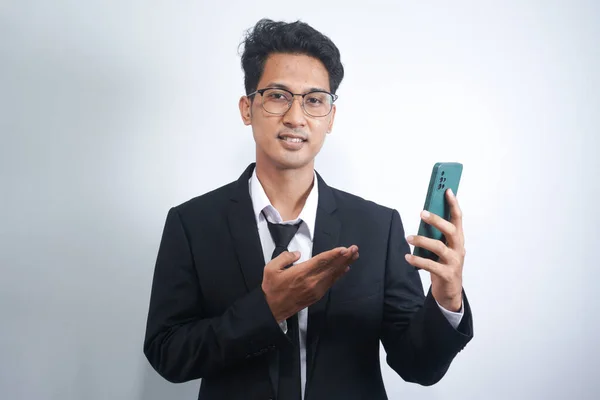 Portrait Happy Asian Young Man Wearing Suit While Pointing Mobile — Fotografia de Stock