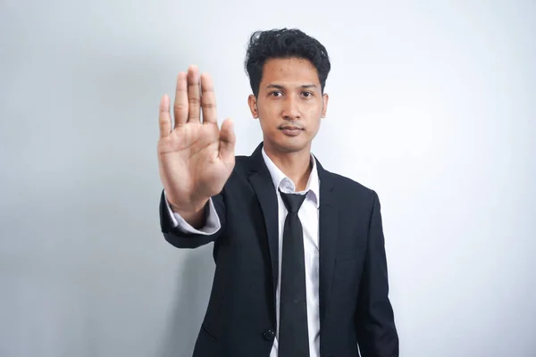 Serious Asian Man Gesturing Stop Showing Palm Camera Grey Studio — Stock Photo, Image