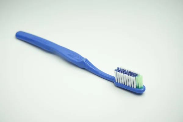 Blue Plastic Toothbrush Top View Sideways Long Term White Background — Stock Photo, Image