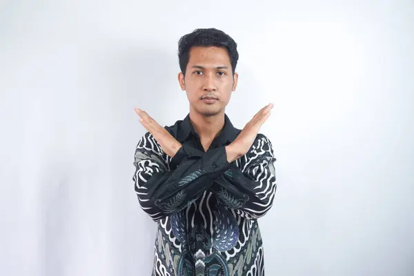 Portrait Serious Handsome Young Man Batik Shirt Standing Sign Hands — Stock Photo, Image