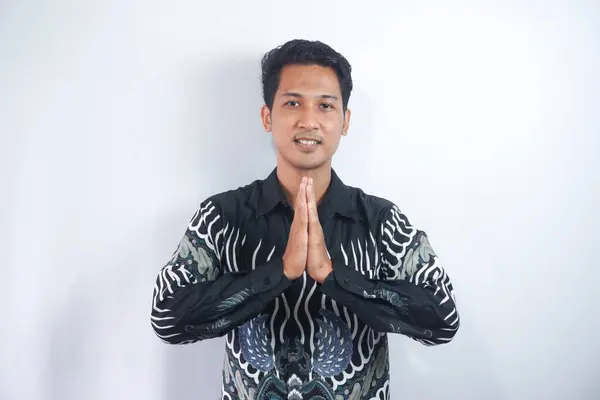 Smiling Young Asian Man Wearing Batik Shirt Gesturing Traditional Greeting — Stock Photo, Image