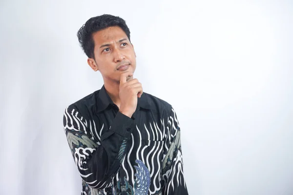 Thoughtful Asian Man Wearing Batik Shirt Looking Aside While Touching — Stock Photo, Image