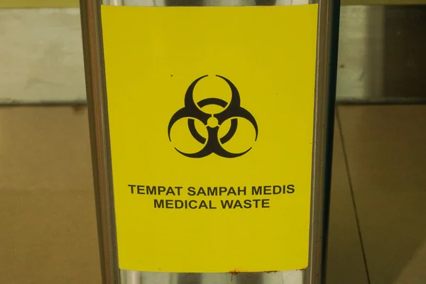 Medical waste bin. Contaminated waste sign. Biohazard trash garbage bin.