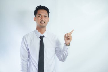 Adult Asian man pointing finger to the left with smiling face clipart