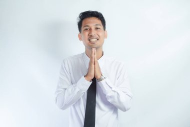 Adult Asian man relax while imagine something with happy expression clipart