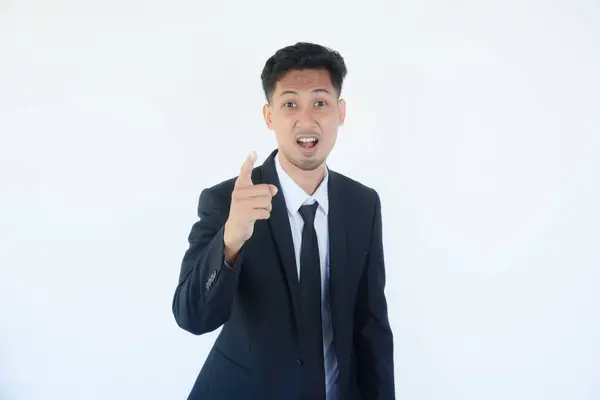 stock image Asian businessman smiling confident and pointing at the camera