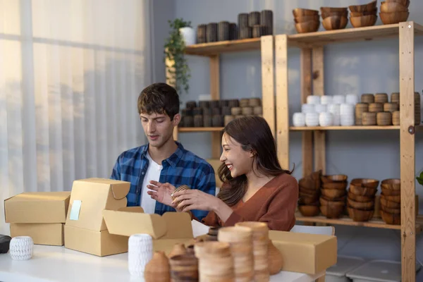 Vase brand owners process online orders, pick product form shelf, photograph, wrap, pack label and prepare for shipping to customers. Giving delivery timeline. Routine work of e-commerce entrepreneur