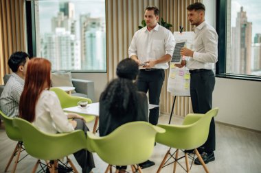 In multicultural workspace, innovative project manager present sustainable solar panel product, fostering collaboration and diversity among colleagues, aiming for efficient, renewable energy solution