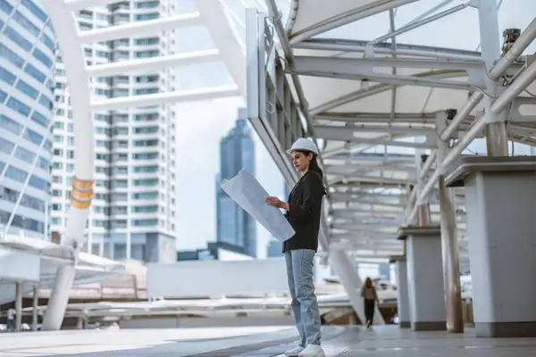 Skilled Female Architect Meticulously Inspects Building Site Skytrain Cross Referencing — Stock Photo, Image