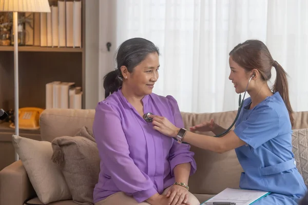 stock image Chiropractor perform home care physical assessments. Providing expert guidance on maintaining proper hygiene, implementing preventive care, making lifestyle adjustments, enhancing overall well-being.