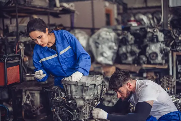 Car service technicians expertly inspect, assess engine parts in storage. Carefully selecting quality gears and instruments for precise repairs, modify, assembly. Assuring optimal vehicle performance