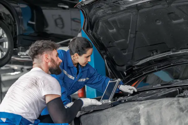 Skilled car service technicians utilize advanced computerized diagnostics and precise tools in garage workshop to analyze, troubleshoot, repair engine and system issues, ensuring optimal performance.