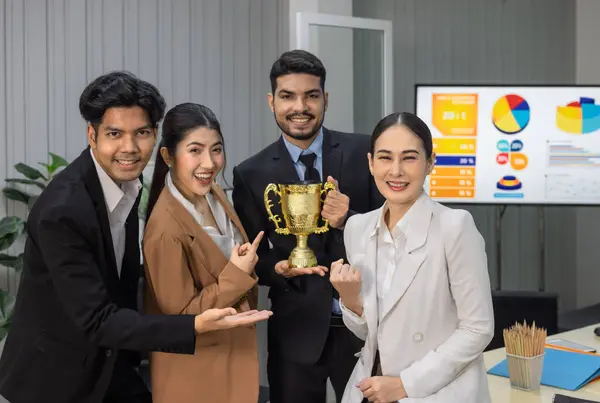 Asian agile business team\'s performance receives positive client feedback and meets expectations. Each member is excited and celebrates enthusiastically. The business team\'s milestone celebration.