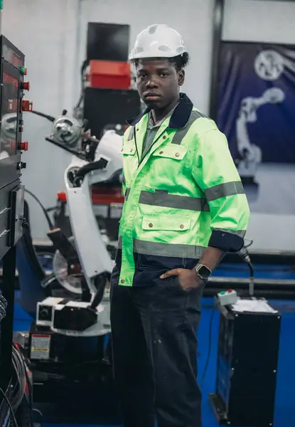 A Robotic Academy mechatronic student performs machine maintenance. addressing issues, and making technical adjustments. Gaining expertise through hands-on training, and practical experience.