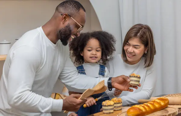 Family Three Father Mother Daughter Delight Baking Sharing Bread Home — Stock Photo, Image
