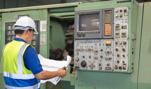 Senior Engineer Safety Gear Examine Machines Highlighting Intricate Details Blueprint — Stock Photo, Image