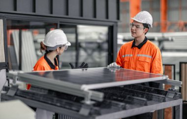 Metal sheet workers at factory plan to install solar panels on roof, promoting renewable energy, reducing costs, registering carbon credits for sustainable and efficient way to combat climate change. clipart