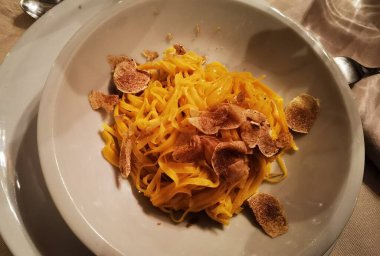 delicious lasagna with white truffle from a restaurant in Alba, in the Piedmontese Langhe in Italy