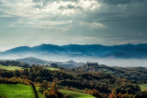 autumn landscapes of the Piedmontese Langhe with its colors and hills near Alba, in the province of Cuneo