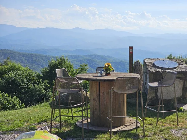 stock image aperitif bar table with a view of the Ligurian hills during a summer day in 2023