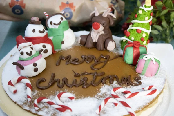 cute christmas cake with fondant decorated snowmen
