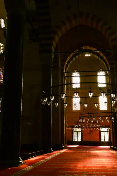 light pouring through little windows inside mosque