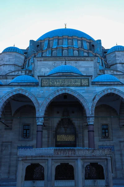 vertical shot of mosque exterior with a clear blue sky
