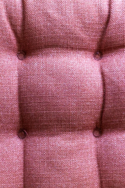 closeup of red couch fabric texture