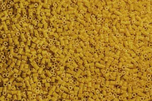 黄色いペンネパスタの背景食感 — ストック写真